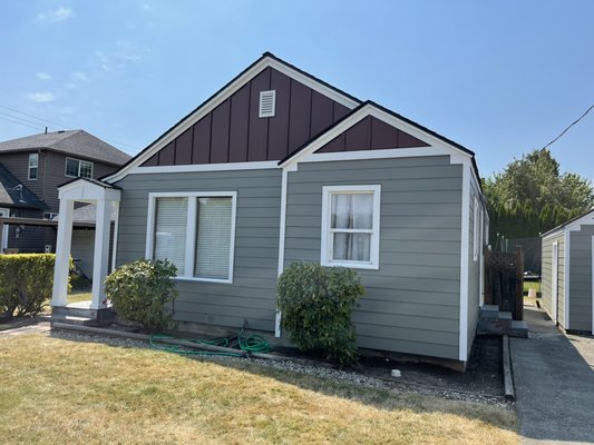 Exterior Painting - The owner had a the old siding and trim replaced, we painted the siding and trim with Sherwin Williams Emerald.