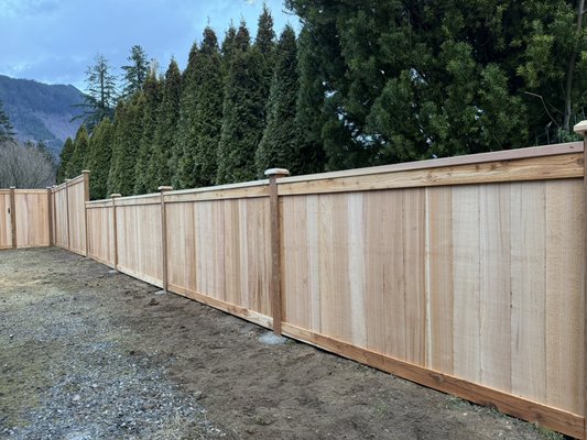 Custom Cedar Privacy Fence & Gate Installation. - Complete clear cedar privacy fence installation with reinforced posts set in concrete. Built using premium clear-grade cedar boards with framed gate and clean trim finish for long-term durability and a high-end appearance.