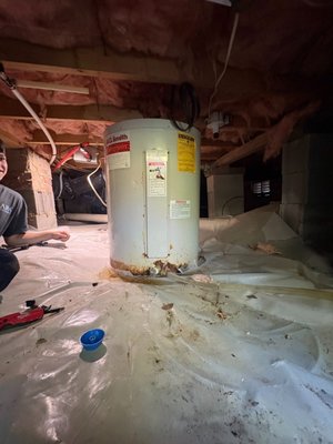 Crawlspace water heater replacement - This water heater was badly corroded and leaking from the bottom, we removed and replaced with a new water heater and expansion tank Crawlspace water heater replacement - This water heater was badly corroded and leaking from the bottom, we removed and replaced with a new water heater and expansion tank