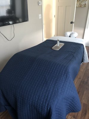In home massage set up for Seaborn Wellness massage - Our massage services use natural and organic ingredients curated to be a balance between therapeutic and a luxurious spa experience. Our therapists are licensed and trained professional contractors you can count on. Most all of our services include hot stones, towels on the feet and aromatherapy! Call or book today!