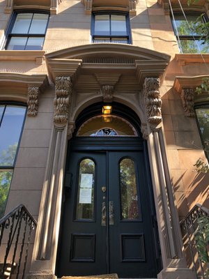 157 Prospect Place (Brooklyn, NY) - The entire front brownstone facade and stoop were cut back to a sound base and completely restored including window & door headers with original brownstone designs approved by NYC Landmark Preservation Commission. 157 Prospect Place (Brooklyn, NY) - The entire front brownstone facade and stoop were cut back to a sound base and completely restored including window & door headers with original brownstone designs approved by NYC Landmark Preservation Commission.