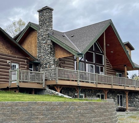 Highlighted Projects: Showcasing Our Craftsmanship and Vision - Custom Log Home: A Rustic Masterpiece
3200 sqft | 3 Bedrooms, 4 Bathrooms

Step into a world of rustic elegance with our custom hybrid-log home. This beautiful, two-story residence features an attached 2-car garage and a daylight basement, seamlessly blending traditional charm with modern amenities.

Key Features:

Stunning Gable End: A statement gable end adorned with a wall of windows floods the open living room, dining room, and kitchen with natural light.

Outdoor Marvel: Two 30 ft river rock chimneys complete the exterior, adding to the home's grandeur.

Enchanting Interior: Enter through the front door to be captivated by cabin charm, vaulted ceilings, and an open floor plan. The living room’s centerpiece is a tall river rock fireplace with a wood-burning stove, enhancing the cozy atmosphere.

This log home is more than a dwelling; it’s a testament to our commitment to creating spaces that are both functional and breathtaking.

Custom Brick Home: Entertainer's Dream
3800 sqft | 3 Bedrooms, 3 Bathrooms

Designed with social gatherings in mind, this custom brick home is the epitome of luxury and convenience.

Key Features:

Welcoming Entrance: A covered front porch with granite columns sets the tone for the elegance within.

Spacious Living Area: The open living space boasts a massive kitchen and dining area highlighted by a full wall of windows. Custom cabinets add warmth, while guests can relax at the sizable kitchen island or enjoy a drink from the built-in keg or wine cooler.

Elegant Centerpiece: The granite fireplace with a propane fire is the heart of the home.

Distinctive Exterior: The house exterior features forest blend brick veneer and salt and pepper granite coin corners, with grounds prepared for a large lawn and terraced garden area.

This home is a perfect blend of sophistication and practicality, ideal for those who love to entertain.

Horse Barn: Functional Elegance
36’x36’

Caring for your four-legged family members has never been easier with our meticulously designed horse barn.

Key Features:

Spacious Stalls: Three 12x12 tongue and groove stalls provide ample space and comfort.

Convenient Tack Room: A heated tack room ensures your gear stays in great shape year-round.

Practical Amenities: Hot and cold running water make bath time a breeze.

This horse barn combines practicality with elegance, offering a top-notch environment for your equine friends.

At Cedar Ridge General Construction, we take pride in our ability to transform visions into reality. Each of these highlighted projects showcases our dedication to quality, attention to detail, and passion for creating unique, beautiful, and functional spaces. Let us bring your dream project to life!