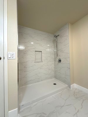 Condo Remodel. - Two sisters who had just purchased a condo together hired us to help bring their vision to life. They needed assistance with installing new kitchen cabinets, countertops, and flooring throughout the unit. We also updated the bathrooms with new tile, a custom shower pan, and a modern vanity. Throughout the project, we ensured everything complied with the HOA’s rules and regulations. Additionally, we guided them in selecting finishes and designing a custom cabinet layout to perfectly suit their style and needs. Condo Remodel. - Two sisters who had just purchased a condo together hired us to help bring their vision to life. They needed assistance with installing new kitchen cabinets, countertops, and flooring throughout the unit. We also updated the bathrooms with new tile, a custom shower pan, and a modern vanity. Throughout the project, we ensured everything complied with the HOA’s rules and regulations. Additionally, we guided them in selecting finishes and designing a custom cabinet layout to perfectly suit their style and needs.