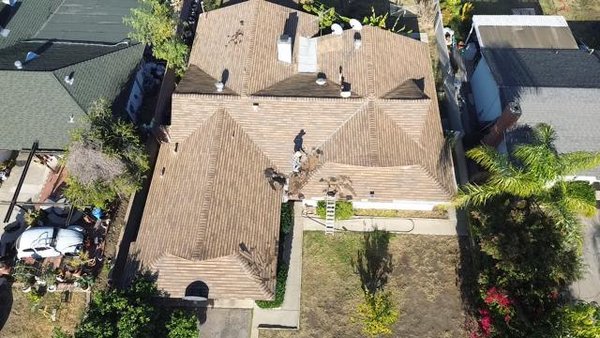 Residential Tile Roof Inspection & Maintenance - This project involved a residential tile roof inspection and maintenance service for a single-family home in Los Angeles, CA. The roof features a multi-hip tile layout, requiring careful evaluation to ensure proper performance and long-term durability.
Our team conducted a full roof inspection, assessing tile condition, alignment, penetrations, flashing areas, and overall roof structure. Any displaced or compromised tiles were identified to prevent potential leaks and future damage.
This service helps homeowners extend the lifespan of their tile roofing system while maintaining safety, performance, and curb appeal. The inspection was completed efficiently and in accordance with industry standards and best practices. Residential Tile Roof Inspection & Maintenance - This project involved a residential tile roof inspection and maintenance service for a single-family home in Los Angeles, CA. The roof features a multi-hip tile layout, requiring careful evaluation to ensure proper performance and long-term durability.
Our team conducted a full roof inspection, assessing tile condition, alignment, penetrations, flashing areas, and overall roof structure. Any displaced or compromised tiles were identified to prevent potential leaks and future damage.
This service helps homeowners extend the lifespan of their tile roofing system while maintaining safety, performance, and curb appeal. The inspection was completed efficiently and in accordance with industry standards and best practices.