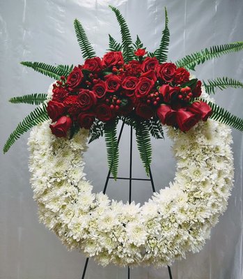 Funeral flowers serve as a tribute to honor the life and memory of a friend or loved one. - Funeral flowers serve as a tribute to honor the life and memory of a friend or loved one. When you find it hard to express your feelings through words alone, a thoughtful delivery of funeral flowers can convey your heartfelt condolences. We offer a diverse selection of funeral flower arrangements, handcrafted with care by Floral by Victoria team. Our range includes both classic designs for traditional services and modern selections for a contemporary tribute.
Offering sympathy flowers is a compassionate way to show you’re thinking of someone during their time of loss.
As always, if you are unsure about what funeral flowers to deliver to express your sympathies, please contact our Specialty Sympathy Advisors toll free 404 934 9348. Each arrangement is available for same-day delivery to the funeral home, church, residence, or office.
Funeral Flower Delivery
When a friend or loved one passes away, many people want to send funeral flowers for delivery to express their heartfelt condolences to the family and other mourners at the service.
Funeral Flower Arrangements
Typical funeral flower selections often feature casket flowers, standing sprays like floral crosses or wreaths, and more intimate arrangements such as sympathy flower baskets. Our collection of funeral flowers spans the favorites: from the serene beauty of lilies and roses to the comforting presence of daisies, mums, and snapdragons. While white flowers are a common choice for funerals, adding a touch of blue, pink, purple, or red can bring a gentle splash of color to honor the individuality of the departed. Beyond the popular choices, we also have smaller arrangements such as sympathy bouquets, vase arrangements, and memorial plants, each a thoughtful way to share your sympathy and support.
Flowers for Funeral: How to Choose the Most Appropriate Arrangements
If you're uncertain about the most fitting flowers for a funeral, our sympathy resources are here to guide you through the etiquette and help you make a choice that feels right for you. Whatever your funeral floral arrangement needs may be, our Sympathy Advisors are here to assist you with thoughtful selection and arrangement, ensuring your flowers are delivered with care to the service or the family's home.
What are appropriate flowers and gifts to send to family, friends, and co-workers for a funeral?
Family: Typically, family members will often send larger traditional funeral arrangement flowers such as, funeral standing wreaths and hearts, standing crosses, large floral standing sprays and casket flowers. The family members will most often send this as a group as one large piece. Some flowers also list the relation of the relative.
Friends: There are different levels of friendship when sending funeral flower arrangements. If you’re close friends or you’re chipping in with a friend group, a larger funeral flower is a good choice such as funeral standing sprays or abundant flower baskets which are often displayed during the service. For friendships that are not as tight knit, funeral flower arrangements that can be displayed at the service are a lovely gesture to send your thoughts and prayers to the family.
Coworkers: When sending funeral flowers to a coworker, you just want to let them know you care. The important thing is they know you’re thinking of them. Professional colleagues may send a group gift, such as a standing spray or a funeral arrangement basket. In many cases for a coworker, sending a card, funeral flowers arrangement or sympathy arrangement to their home is also appropriate. Gourmet foods can be a comforting gift during a difficult time as well, such as baskets filled with snacks or food for the family. Sympathy baskets can be a great idea as well for coworkers to let them know you’re thinking about them. Funeral flowers serve as a tribute to honor the life and memory of a friend or loved one. - Funeral flowers serve as a tribute to honor the life and memory of a friend or loved one. When you find it hard to express your feelings through words alone, a thoughtful delivery of funeral flowers can convey your heartfelt condolences. We offer a diverse selection of funeral flower arrangements, handcrafted with care by Floral by Victoria team. Our range includes both classic designs for traditional services and modern selections for a contemporary tribute.
Offering sympathy flowers is a compassionate way to show you’re thinking of someone during their time of loss.
As always, if you are unsure about what funeral flowers to deliver to express your sympathies, please contact our Specialty Sympathy Advisors toll free 404 934 9348. Each arrangement is available for same-day delivery to the funeral home, church, residence, or office.
Funeral Flower Delivery
When a friend or loved one passes away, many people want to send funeral flowers for delivery to express their heartfelt condolences to the family and other mourners at the service.
Funeral Flower Arrangements
Typical funeral flower selections often feature casket flowers, standing sprays like floral crosses or wreaths, and more intimate arrangements such as sympathy flower baskets. Our collection of funeral flowers spans the favorites: from the serene beauty of lilies and roses to the comforting presence of daisies, mums, and snapdragons. While white flowers are a common choice for funerals, adding a touch of blue, pink, purple, or red can bring a gentle splash of color to honor the individuality of the departed. Beyond the popular choices, we also have smaller arrangements such as sympathy bouquets, vase arrangements, and memorial plants, each a thoughtful way to share your sympathy and support.
Flowers for Funeral: How to Choose the Most Appropriate Arrangements
If you're uncertain about the most fitting flowers for a funeral, our sympathy resources are here to guide you through the etiquette and help you make a choice that feels right for you. Whatever your funeral floral arrangement needs may be, our Sympathy Advisors are here to assist you with thoughtful selection and arrangement, ensuring your flowers are delivered with care to the service or the family's home.
What are appropriate flowers and gifts to send to family, friends, and co-workers for a funeral?
Family: Typically, family members will often send larger traditional funeral arrangement flowers such as, funeral standing wreaths and hearts, standing crosses, large floral standing sprays and casket flowers. The family members will most often send this as a group as one large piece. Some flowers also list the relation of the relative.
Friends: There are different levels of friendship when sending funeral flower arrangements. If you’re close friends or you’re chipping in with a friend group, a larger funeral flower is a good choice such as funeral standing sprays or abundant flower baskets which are often displayed during the service. For friendships that are not as tight knit, funeral flower arrangements that can be displayed at the service are a lovely gesture to send your thoughts and prayers to the family.
Coworkers: When sending funeral flowers to a coworker, you just want to let them know you care. The important thing is they know you’re thinking of them. Professional colleagues may send a group gift, such as a standing spray or a funeral arrangement basket. In many cases for a coworker, sending a card, funeral flowers arrangement or sympathy arrangement to their home is also appropriate. Gourmet foods can be a comforting gift during a difficult time as well, such as baskets filled with snacks or food for the family. Sympathy baskets can be a great idea as well for coworkers to let them know you’re thinking about them.