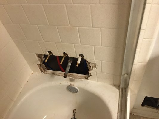 We took out all the valve and replaced with a new one￼ - We removed old shower valve and install a new one￼