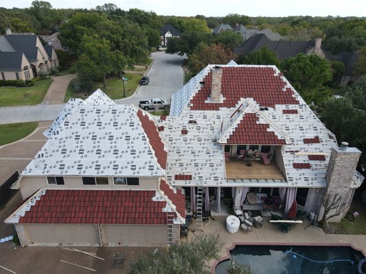 Colleyville Stone Coated Steel - This was an old stone coated steel home with wood shake shingles underneath. We had to remove the wood shake and re-deck the roof before installation. It was a wonderful job that finished in one weeks time. Colleyville Stone Coated Steel - This was an old stone coated steel home with wood shake shingles underneath. We had to remove the wood shake and re-deck the roof before installation. It was a wonderful job that finished in one weeks time.