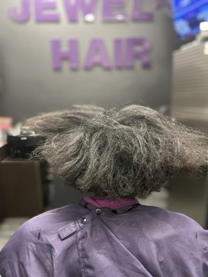 Chemical process-Hair restoration - This hair restoration process involves use of a chemical relaxer. The client was using a home box relaxer which caused calcium buildup resulting in dryness and breakage. I used deep conditioning products, trimmed, and styled her hair.