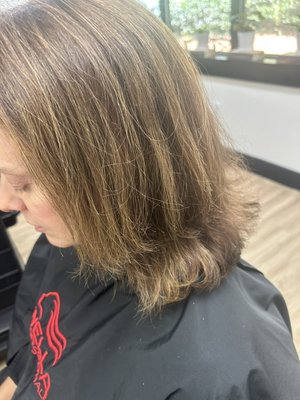 From choppy and dull to soft luxurious brunette with dimension - This client came back to me after 5 years because she was not happy with her choppy haircut and brassy hair. I fixed her haircut and gave her soft layers and corrected the color to suit her skin tone. We went with a beautiful brunette with ribbons of cool caramel to bring out the depth and shine