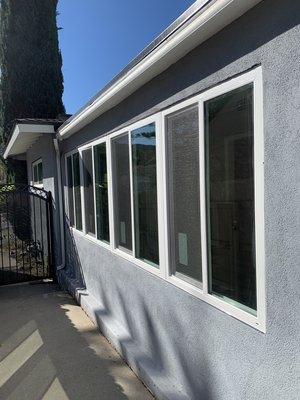 Sliding window installation. - This remodel was done in a den, to have better ventilation while maintaining a garden view.
