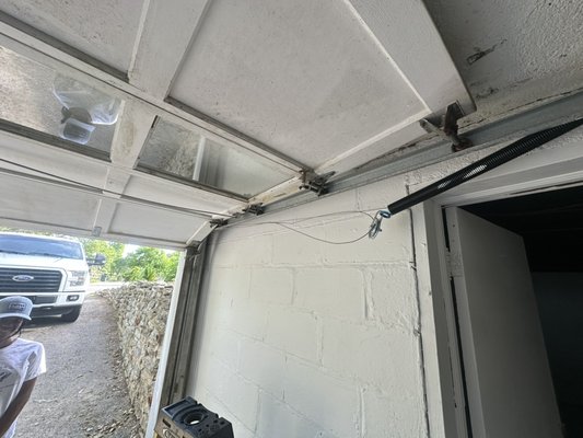 Garage Door - Garage doors before repair.