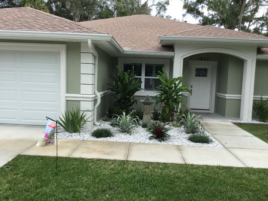 Queenpalm Dr-Edgewater, FL - This project turned out to be a complete redesign. We has to fix most all the irrigation and change layout. Prep all the landscape beds with weed barrier. Install rock walkways and rock cobble stone perimeter. Install tropical landscape plants and use decorative marble chips. Visit our website for detailed images. www.exoticdesignslandscaping.com