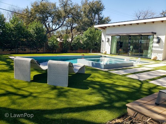 Backyard Pool renovation - This beautiful backyard had a pool house remodel and upgrade to the pool. The large family with kids and pets was a muddy mess when the kids were in and out of the pool running to the house. By using LawnPop synthetic grass, it's a major upgrade for this family. No more watering. No more maintenance. LawnPop artificial grass is an eco-friendly design solution that saves water.