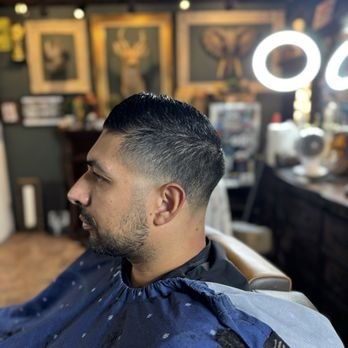 Oscar's Classic Barbershop Chapter One - For over 30 years, Oscar’s Classic Barbershop Chapter One has set the standard for exceptional grooming, combining timeless techniques with a welcoming, neighborhood vibe. Our experienced barbers specialize in precision fades, sharp cuts, expertly styled beard trims, and rejuvenating hot lather treatments. Whether you’re here for a classic look or a modern style, we tailor each service to ensure you leave refreshed and looking your best. With decades of happy clients and a five-star reputation, we invite you to discover the difference experience makes—visit Oscar’s for service you’ll return to again and again! Oscar's Classic Barbershop Chapter One - For over 30 years, Oscar’s Classic Barbershop Chapter One has set the standard for exceptional grooming, combining timeless techniques with a welcoming, neighborhood vibe. Our experienced barbers specialize in precision fades, sharp cuts, expertly styled beard trims, and rejuvenating hot lather treatments. Whether you’re here for a classic look or a modern style, we tailor each service to ensure you leave refreshed and looking your best. With decades of happy clients and a five-star reputation, we invite you to discover the difference experience makes—visit Oscar’s for service you’ll return to again and again!