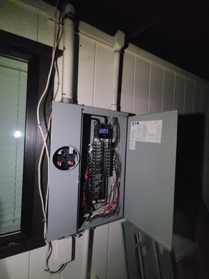 emergency panel replacement - tree feel on customers property pulling their electric panel off the wall . We came that night, installed a new panel so we could have an inspection in the morning.