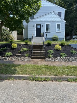 Hillside Renovation - Here we transformed a hillside of ivy and grass to a modern fresh feeling landscape