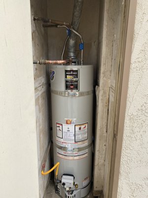 Before and after of a water heater installation - Before and after of a simple water heater change out.  The old unit had an unsafe vent and wasn't working properly.  In this case, the unit was too old to make the cost of repairing it a worthwhile investment, so we changed it out and corrected some minor issues along the way.