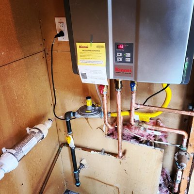 Tankless water heater installation - Conversion of 50 gallon gas water heater to Rinnai tankless water heater with built in recirculating pump for instant hot water. Tankless water heater installation - Conversion of 50 gallon gas water heater to Rinnai tankless water heater with built in recirculating pump for instant hot water.