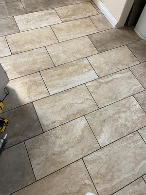 Tile replacement - The old tile in the kitchen was removed and replaced with new ones. Then, everything was grouted and cleaned up.