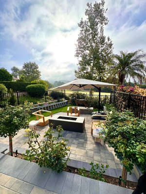 Interlocking Pavers, Pergola, Outdoor Kitchen and Turf By Vitoli Landscape Design, Leading Landscape Contractor In Long Beach, CA - Transform your outdoor space with this stunning project by Vitoli Landscape Design, the leading landscape contractor in Long Beach, CA. Our latest work features an intricate blend of interlocking pavers, a stylish pergola, a fully equipped outdoor kitchen, and lush artificial turf, designed to elevate your backyard into a perfect haven for relaxation and entertainment.
The interlocking pavers provide a durable and aesthetically pleasing foundation that seamlessly integrates with the surrounding landscape, offering both functionality and visual appeal. Complementing this hardscape is a custom-built pergola, designed to create a shaded retreat, perfect for enjoying sunny California days in comfort and style.
The outdoor kitchen is a chef’s dream, featuring high-quality appliances and ample counter space, making it ideal for hosting family gatherings and social events. Adjacent to the kitchen, the artificial turf adds a vibrant touch of green, maintaining its pristine look year-round with minimal maintenance.
Every element of this project is meticulously crafted to ensure a harmonious blend of style and practicality, embodying the quality and expertise Vitoli Landscape Design is known for. Whether you’re hosting a summer barbecue or seeking a quiet place to unwind, this outdoor space offers endless possibilities. Interlocking Pavers, Pergola, Outdoor Kitchen and Turf By Vitoli Landscape Design, Leading Landscape Contractor In Long Beach, CA - Transform your outdoor space with this stunning project by Vitoli Landscape Design, the leading landscape contractor in Long Beach, CA. Our latest work features an intricate blend of interlocking pavers, a stylish pergola, a fully equipped outdoor kitchen, and lush artificial turf, designed to elevate your backyard into a perfect haven for relaxation and entertainment.
The interlocking pavers provide a durable and aesthetically pleasing foundation that seamlessly integrates with the surrounding landscape, offering both functionality and visual appeal. Complementing this hardscape is a custom-built pergola, designed to create a shaded retreat, perfect for enjoying sunny California days in comfort and style.
The outdoor kitchen is a chef’s dream, featuring high-quality appliances and ample counter space, making it ideal for hosting family gatherings and social events. Adjacent to the kitchen, the artificial turf adds a vibrant touch of green, maintaining its pristine look year-round with minimal maintenance.
Every element of this project is meticulously crafted to ensure a harmonious blend of style and practicality, embodying the quality and expertise Vitoli Landscape Design is known for. Whether you’re hosting a summer barbecue or seeking a quiet place to unwind, this outdoor space offers endless possibilities.