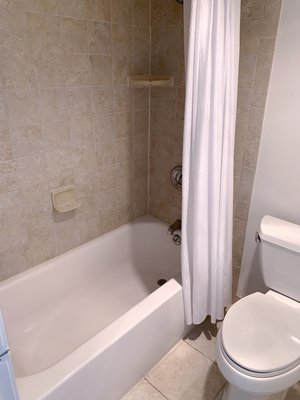 before & after bathroom cleanup - This bathroom wasn’t a hard project to be done, that being said we still made sure to make it flawless. There were a few minor stains on the bathtub, and a bit of dirt on the wall that we removed.