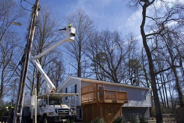 Crane job in Pasadena, MD - Tree job in Pasadena, MD - Job required a crane to prevent damages to the property since the tree was near the house.