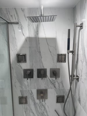 Shower with Body Sprays - These body sprays and volume controls were all installed using a laser and are all identically level. We take great pride in making sure the homeowner gets exactly what they want out of their shower, and is extremely happy with the end result.
