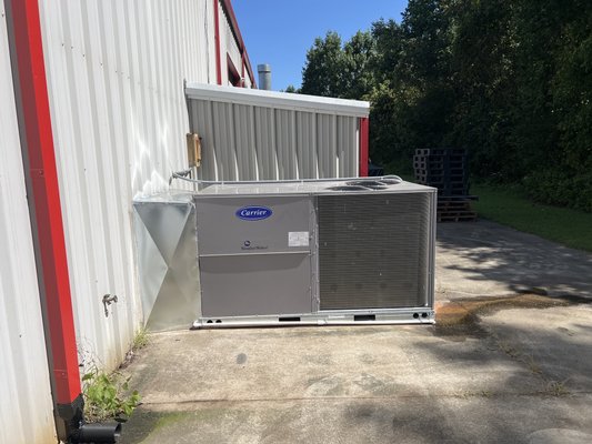 Commercial package unit installation - This project was performed at a local race shop. The guys in there were pretty happy once we got the unit running. This was a fun project. Field made and modified the ducting to connect the new unit to the existing duct work. Then custom made a weather/ critter shield from the unit to the building. Commercial package unit installation - This project was performed at a local race shop. The guys in there were pretty happy once we got the unit running. This was a fun project. Field made and modified the ducting to connect the new unit to the existing duct work. Then custom made a weather/ critter shield from the unit to the building.