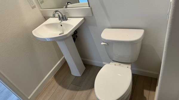 Restroom Repair - Original Cabinet Sink was removed due to water damaged and mold. 

Repaired Restroom Flooring, Relocated Sink and swapped for a pedestal sink, Installed Base board and painted.