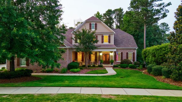3820 Blue Springs Trace Evans, GA Real Estate | VA Assumable Rate Mortgage for Eligible Veterans - Welcome to 3820 Blue Springs Trace in Bartram Trail - a truly exceptional, better-than-new custom home originally built by a custom builder as his personal residence. Designed with care, precision, and no upgrade left undone, this 7-bedroom, 5 1/2 bathroom home with an amazing home office, offers over-the-top quality across all three finished levels. Step into a grand yet comfortable living space where the gourmet kitchen flows seamlessly into the great room and breakfast area. High-end finishes include granite countertops, a gas cooktop, double wall ovens, eat-at island, and bar seating, perfect for both entertaining and everyday life. As you notice the high ceilings , extensive crown molding throughout, and tall doors, you'll feel the quality craftmanship in this home. The main floor features two bedrooms, including a luxurious owner's suite and a private guest suite. Upstairs, you'll find three oversized bedrooms, two full bathrooms, walk-in attic storage, and a newly added study or home office. The fully finished basement features luxury vinyl tile (LVT) flooring, two additional bedrooms, a full bath, spacious rec room, and upgraded poured concrete walls, known for their superior strength, moisture resistance, energy efficiency, and durability. There's also generous unfinished storage space ideal for lawn and sports equipment. Out back, enjoy an enclosed porch adorned with Brazilian Cherry wood floors and a patio overlooking a stunning yard with a custom putting green and cozy firepit—perfect for play, peaceful relaxation, or gathering under the stars. The 3-car garage plan is extended by an additional golf cart garage at the back, making this home perfect for golfers, hobbyists, or those needing extra storage. Added Values: A VA assumable mortgage is available for eligible veterans offering an incredible opportunity to take advantage of a favorable interest rate! This home is also a great income producer as a golf tournament rental. Freshly painted exterior & 2 top of the line Bosch HVAC units. Bartram Trail amenities include a clubhouse, public golf course, and walking trails including access to Euchee Creek Greenway! You can also easily take a golf cart ride up to the community pool or eat dinner at Tavern on the Trail. Schedule your tee time at Bartram Trail Golf Club or store your boat or RV at the community storage. Located close to I-20 Exit 190, restaurants, shopping, Patriots Park, and top-rated Columbia County Schools, this home certainly has it all. If you are looking for resort style living and want a strong sense of community, this is the place for you. This is more than just a home, it's a rare find in the coveted Bartram Trail golf course community in Evans. Better than new. Built with pride. Packed with value. Sold. 3820 Blue Springs Trace Evans, GA Real Estate | VA Assumable Rate Mortgage for Eligible Veterans - Welcome to 3820 Blue Springs Trace in Bartram Trail - a truly exceptional, better-than-new custom home originally built by a custom builder as his personal residence. Designed with care, precision, and no upgrade left undone, this 7-bedroom, 5 1/2 bathroom home with an amazing home office, offers over-the-top quality across all three finished levels. Step into a grand yet comfortable living space where the gourmet kitchen flows seamlessly into the great room and breakfast area. High-end finishes include granite countertops, a gas cooktop, double wall ovens, eat-at island, and bar seating, perfect for both entertaining and everyday life. As you notice the high ceilings , extensive crown molding throughout, and tall doors, you'll feel the quality craftmanship in this home. The main floor features two bedrooms, including a luxurious owner's suite and a private guest suite. Upstairs, you'll find three oversized bedrooms, two full bathrooms, walk-in attic storage, and a newly added study or home office. The fully finished basement features luxury vinyl tile (LVT) flooring, two additional bedrooms, a full bath, spacious rec room, and upgraded poured concrete walls, known for their superior strength, moisture resistance, energy efficiency, and durability. There's also generous unfinished storage space ideal for lawn and sports equipment. Out back, enjoy an enclosed porch adorned with Brazilian Cherry wood floors and a patio overlooking a stunning yard with a custom putting green and cozy firepit—perfect for play, peaceful relaxation, or gathering under the stars. The 3-car garage plan is extended by an additional golf cart garage at the back, making this home perfect for golfers, hobbyists, or those needing extra storage. Added Values: A VA assumable mortgage is available for eligible veterans offering an incredible opportunity to take advantage of a favorable interest rate! This home is also a great income producer as a golf tournament rental. Freshly painted exterior & 2 top of the line Bosch HVAC units. Bartram Trail amenities include a clubhouse, public golf course, and walking trails including access to Euchee Creek Greenway! You can also easily take a golf cart ride up to the community pool or eat dinner at Tavern on the Trail. Schedule your tee time at Bartram Trail Golf Club or store your boat or RV at the community storage. Located close to I-20 Exit 190, restaurants, shopping, Patriots Park, and top-rated Columbia County Schools, this home certainly has it all. If you are looking for resort style living and want a strong sense of community, this is the place for you. This is more than just a home, it's a rare find in the coveted Bartram Trail golf course community in Evans. Better than new. Built with pride. Packed with value. Sold.