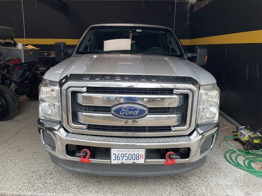 Ford F-250 Racing Stripes - This F-250 was brought in to add Bumper to Bumper Racing stripes. Done in Brushed Titanium from Avery Dennison