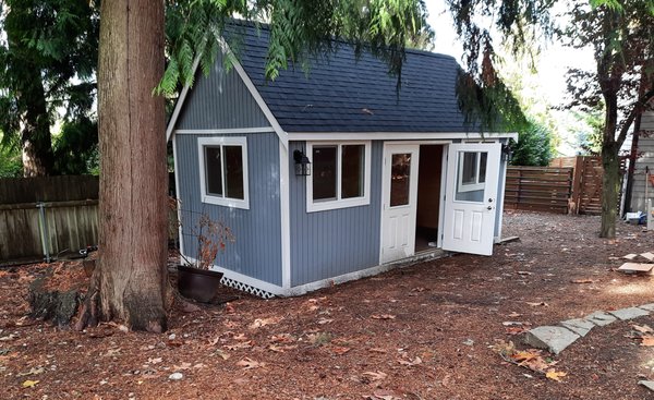 Craftsman Style Shed 20W X 10D - Our Craftsman Style Shed looks very similar to our Rancher Style Shed. The difference is that the Craftsman has a higher pitched roof. The benefits of a higher pitched roof is that it provides additional head room interiorly and is a great option for customers who would like a loft inside their shed.
These Bothell customers wanted to build a shed specifically designed for an at home gym and found that a Craftsman shed would best accommodate their needs. They requested a loft to store yoga mats, resistance tubes and bands, and other fitness accessories. They also opted in for our full electrical and heating package to create a functional gym experience. There are outlets to plug in machines that require electricity and for their wall mounted flat screen TV.
Outdoor home gyms are a popular request from our customers. It is a great option for those who want to avoid fitness clubs or free up space in their home that is taken up by large gym equipment. Craftsman Style Shed 20W X 10D - Our Craftsman Style Shed looks very similar to our Rancher Style Shed. The difference is that the Craftsman has a higher pitched roof. The benefits of a higher pitched roof is that it provides additional head room interiorly and is a great option for customers who would like a loft inside their shed.
These Bothell customers wanted to build a shed specifically designed for an at home gym and found that a Craftsman shed would best accommodate their needs. They requested a loft to store yoga mats, resistance tubes and bands, and other fitness accessories. They also opted in for our full electrical and heating package to create a functional gym experience. There are outlets to plug in machines that require electricity and for their wall mounted flat screen TV.
Outdoor home gyms are a popular request from our customers. It is a great option for those who want to avoid fitness clubs or free up space in their home that is taken up by large gym equipment.
