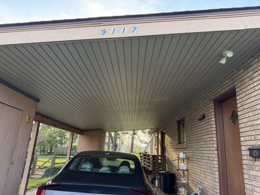 Carport Ceiling & Soffit Replacement - This project included removing the old carport ceiling/soffit panels and installing new vinyl soffit for a clean, finished look. We inspected the exposed wood framing, replaced the ceiling material, and completed the installation with matching trim for a neat appearance. The new soffit improves the overall curb appeal of the carport area and provides a clean, low-maintenance finish.