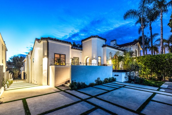 Contemporary Spanish Revival - A complete remodel and transformation of a 1920’s dilapidated Spanish-style bungalow into a mid-century modern contemporary private urban oasis. The owners strictly required single-story indoor/outdoor living. Their property has a steep down slope but they wished to access their pool and outdoor kitchen on the same level as their living space. Our architects and engineers designed an expansive above-ground deck to encapsulate an elevated swimming pool with parking below. Contemporary Spanish Revival - A complete remodel and transformation of a 1920’s dilapidated Spanish-style bungalow into a mid-century modern contemporary private urban oasis. The owners strictly required single-story indoor/outdoor living. Their property has a steep down slope but they wished to access their pool and outdoor kitchen on the same level as their living space. Our architects and engineers designed an expansive above-ground deck to encapsulate an elevated swimming pool with parking below.