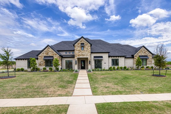 4300 American Pharoah - -$2.725m
-5881sf
-1.5 stories
-7 total baths (5 full)
-media
-pool w/hot tub
-1 acre
-4 car garage
-Celina schools
Former Dave R. Williams model home in exclusive, one-acre section of Mustang Lakes is pristine! Full of natural light, in a transitional style with open floor plan. Welcome your guests to the lounge area complete with lighted shelving and built-in bar. Beautiful nailed-down wood floors run throughout the main walkways. Chef's kitchen includes Wolf appliances, custom cabinetry with quartz countertops and massive eat-in island-all next to the Great Room with linear fireplace and view of the pool. Open the barn doors in the study to view the coffered ceiling. Secluded Master with built-in coffee bar, luxurious bathroom and Master closet connected to utility for easy access. Enjoy a movie in the Media room with built-in bar while kids play in separate activity room. Upstairs bedroom with full bath is great space for guests or college student. Private backyard boasts expansive outdoor living with see-thru fireplace, TV connection, patio screens and inviting pool. Prosper ISD schools. 4300 American Pharoah - -$2.725m
-5881sf
-1.5 stories
-7 total baths (5 full)
-media
-pool w/hot tub
-1 acre
-4 car garage
-Celina schools
Former Dave R. Williams model home in exclusive, one-acre section of Mustang Lakes is pristine! Full of natural light, in a transitional style with open floor plan. Welcome your guests to the lounge area complete with lighted shelving and built-in bar. Beautiful nailed-down wood floors run throughout the main walkways. Chef's kitchen includes Wolf appliances, custom cabinetry with quartz countertops and massive eat-in island-all next to the Great Room with linear fireplace and view of the pool. Open the barn doors in the study to view the coffered ceiling. Secluded Master with built-in coffee bar, luxurious bathroom and Master closet connected to utility for easy access. Enjoy a movie in the Media room with built-in bar while kids play in separate activity room. Upstairs bedroom with full bath is great space for guests or college student. Private backyard boasts expansive outdoor living with see-thru fireplace, TV connection, patio screens and inviting pool. Prosper ISD schools.