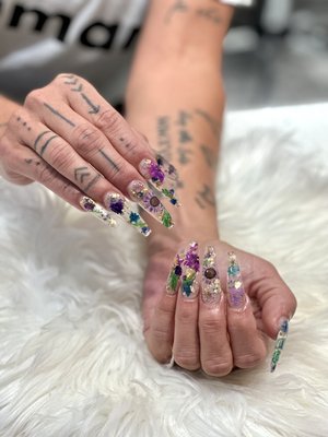Tracy’s Talents - Miss Tracy has been in the nail business for over 7 yrs but only joined our salon early 2024, in that short time she has made a name for herself with her extensive design work! Her attention to detail is unmatched. Her goal -like others- is to have you smiling when leaving our salon :)

*When scheduling, please let us know if you need additional time for designs.*