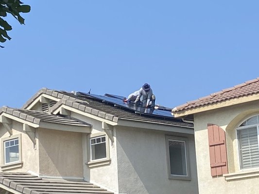Techs hard at work to assure clean installs - Installing tier 1 panels and inverters for another happy customer