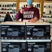 Sean G. from Austin High takes delivery of some great new Panasonic cameras for his Multimedia class! 