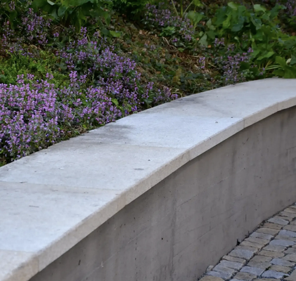 Retaining Walls - Quality Retaining Walls Built to Last: 

Sloped yards are common across Georgia, and Athens is no exception. Hills and uneven ground may look natural, but they create drainage problems, soil erosion, and wasted space. Retaining walls solve these issues by holding back soil and creating flat, usable areas. They also add structure and style to landscapes. Whether supporting a garden bed, shaping a patio, or protecting against runoff, concrete retaining walls provide long-lasting strength. AA Concrete Athens builds walls that handle local soil and weather while improving the look and function of a property.

Common Uses in Athens:
Retaining walls serve many purposes for both homes and businesses:

*Support for patios or outdoor living areas
*Borders for gardens and flower beds
*Terracing on steep hillsides
*Barriers that protect against flooding or washouts
*Dividers that separate spaces in large yards or properties

Each wall is designed to meet both functional and visual goals.