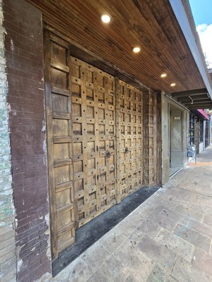 hoekes death metal pizza cathedral door install - Custom Historic Church Door Install – Hoek’s Death Metal Pizza, Downtown Austin
For Hoek’s Death Metal Pizza in downtown Austin, this entrance was built around a set of doors purchased from an 18th-century European church, giving the storefront a real historic presence instead of a manufactured theme. The heavy wood panels, aged finish, iron-style details, and oversized ring pulls create a bold old-world look that fits perfectly with the gritty character of the space.
The build focused on making the doors work as both a functional entrance and a major visual feature. The surrounding frame and trim were finished to match the aged wood, so the whole entry feels intentional, established, and built into the building rather than simply installed on it.
The final result is a one-of-a-kind downtown Austin storefront with genuine historic character, heavy craftsmanship, and a dark, dramatic style that matches the Hoek’s Death Metal Pizza brand. hoekes death metal pizza cathedral door install - Custom Historic Church Door Install – Hoek’s Death Metal Pizza, Downtown Austin
For Hoek’s Death Metal Pizza in downtown Austin, this entrance was built around a set of doors purchased from an 18th-century European church, giving the storefront a real historic presence instead of a manufactured theme. The heavy wood panels, aged finish, iron-style details, and oversized ring pulls create a bold old-world look that fits perfectly with the gritty character of the space.
The build focused on making the doors work as both a functional entrance and a major visual feature. The surrounding frame and trim were finished to match the aged wood, so the whole entry feels intentional, established, and built into the building rather than simply installed on it.
The final result is a one-of-a-kind downtown Austin storefront with genuine historic character, heavy craftsmanship, and a dark, dramatic style that matches the Hoek’s Death Metal Pizza brand.
