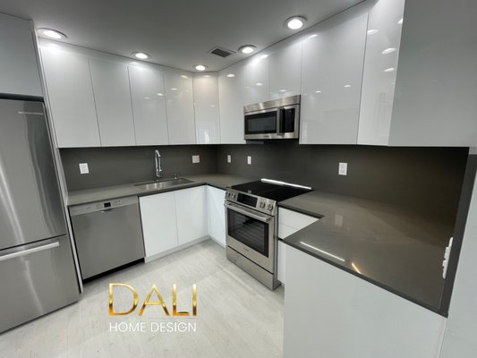 New Kitchen January 2024 - Completed in the enchanting city of Aventura, Florida, this project brought to life a customer's vision for a sleek and minimalist kitchen designed for a penthouse. The customer's preferences included pristine white European-style cabinets paired with a sophisticated gray quartz stone material for both the countertop and the kitchen's backsplash. New Kitchen January 2024 - Completed in the enchanting city of Aventura, Florida, this project brought to life a customer's vision for a sleek and minimalist kitchen designed for a penthouse. The customer's preferences included pristine white European-style cabinets paired with a sophisticated gray quartz stone material for both the countertop and the kitchen's backsplash.