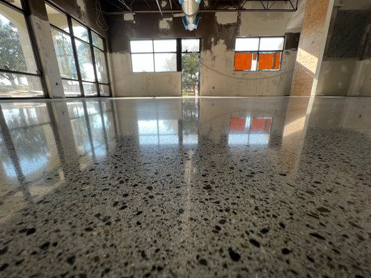 Concrete Overlayment and Polish - At KJZ Floor Solutions, we specialize in concrete overlayment installation and polishing, employing a meticulous procedure to ensure flawless results.

The process begins with thorough surface preparation, including cleaning and repairing any imperfections in the existing concrete. Next, we apply a high-quality overlayment material, carefully smoothing it to create a seamless surface. This overlayment not only enhances the appearance of the concrete but also provides added strength and durability.

Once the overlayment has cured, our skilled technicians meticulously polish the surface using advanced equipment and techniques. This involves multiple passes with progressively finer abrasives to achieve the desired level of shine and smoothness.

Throughout the polishing process, we pay close attention to detail, ensuring that every corner and edge is properly finished. We also take care to address any imperfections that may arise, maintaining our commitment to excellence in craftsmanship.

Finally, we apply a protective sealant to the polished surface, enhancing its durability and resistance to stains and damage.

At KJZ Floor Solutions, we understand that every project is unique, and we tailor our approach to meet the specific needs and preferences of each client. With our expertise and attention to detail, you can trust us to deliver exceptional results that will transform your concrete surfaces into stunning works of art.