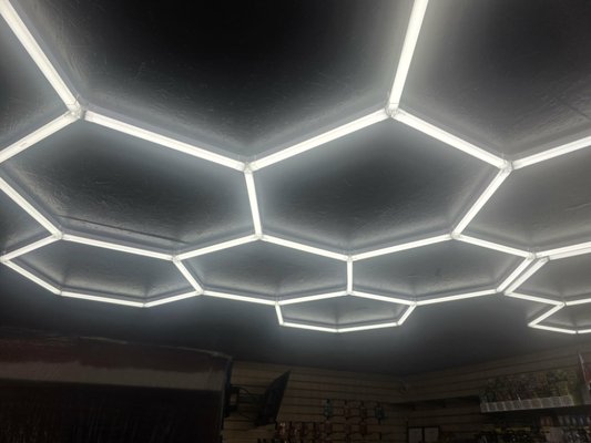 L.E.D. light installation/signs - Precision Layout: Graphically mapped and flush-mounted a modular LED hexagon grid system with perfect symmetry.
Seamless Finish: Professionally wired and concealed all electrical components against a dark-finished ceiling for maximum visual contrast.
High-Impact Lighting: Delivered crisp, high-output, shadow-free illumination designed to modernize the space and elevate the entire showroom environment. L.E.D. light installation/signs - Precision Layout: Graphically mapped and flush-mounted a modular LED hexagon grid system with perfect symmetry.
Seamless Finish: Professionally wired and concealed all electrical components against a dark-finished ceiling for maximum visual contrast.
High-Impact Lighting: Delivered crisp, high-output, shadow-free illumination designed to modernize the space and elevate the entire showroom environment.
