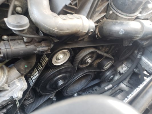 Drive Belt - I have never seen this before. On this Mercedes, the idler pully basically exploded and tore the drive belt to pieces. Thankfully the customer pulled over and no further engine damage was done. Here it is all put back together. Drive Belt - I have never seen this before. On this Mercedes, the idler pully basically exploded and tore the drive belt to pieces. Thankfully the customer pulled over and no further engine damage was done. Here it is all put back together.