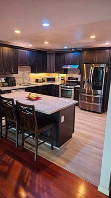 Custom Kitchen Remodel & Design in San Diego - We recently had the privilege of working on a magnificent home where the homeowners sought to transform their outdated kitchen into a sleek, modern, and highly functional space.
Our journey from start to finish spanned approximately 14 days. It commenced with close collaboration between our team and the homeowners to fully grasp their vision and specific requirements. The clients expressed a desire for contemporary cabinetry that not only exuded elegance but also maximized storage and convenience.
Once we had meticulously finalized the design, our skilled craftsmen swung into action. We began by meticulously removing the dated cabinets, countertops, and backsplash, making way for the installation of new elements. The heart of the transformation was the installation of cabinets crafted from top-tier materials, delivering the perfect fusion of aesthetics and longevity.
Our dedication to enhancing kitchen functionality was apparent in the clever storage solutions we integrated, including pull-out drawers, built-in spice racks, and specialized compartments for cutting boards and baking sheets. These cabinets were crowned with a stunning, easy-to-clean surface that seamlessly complemented the overall design.
The transformation didn't stop at cabinets; we also upgraded the countertops with luxurious quartz material and adorned the space with a stylish tile backsplash that injected an additional touch of elegance. The homeowners were ecstatic with the final outcome, as the new kitchen brought an entirely fresh atmosphere to their cherished home.
Throughout the project, we maintained transparent and frequent communication with the homeowners, ensuring their peace of mind and addressing any concerns without delay. Our unwavering commitment to quality workmanship and an acute attention to detail was our pledge to deliver a seamless and visually captivating outcome.
Witnessing the sheer joy on our clients' faces upon the revelation of their new kitchen was an incredibly rewarding experience. It's projects like these that fuel our passion for delivering exceptional craftsmanship and client satisfaction. If you have any specific questions about this project or would like to discuss your own kitchen remodel, please don't hesitate to reach out. We're here to assist you at every step of the way. Custom Kitchen Remodel & Design in San Diego - We recently had the privilege of working on a magnificent home where the homeowners sought to transform their outdated kitchen into a sleek, modern, and highly functional space.
Our journey from start to finish spanned approximately 14 days. It commenced with close collaboration between our team and the homeowners to fully grasp their vision and specific requirements. The clients expressed a desire for contemporary cabinetry that not only exuded elegance but also maximized storage and convenience.
Once we had meticulously finalized the design, our skilled craftsmen swung into action. We began by meticulously removing the dated cabinets, countertops, and backsplash, making way for the installation of new elements. The heart of the transformation was the installation of cabinets crafted from top-tier materials, delivering the perfect fusion of aesthetics and longevity.
Our dedication to enhancing kitchen functionality was apparent in the clever storage solutions we integrated, including pull-out drawers, built-in spice racks, and specialized compartments for cutting boards and baking sheets. These cabinets were crowned with a stunning, easy-to-clean surface that seamlessly complemented the overall design.
The transformation didn't stop at cabinets; we also upgraded the countertops with luxurious quartz material and adorned the space with a stylish tile backsplash that injected an additional touch of elegance. The homeowners were ecstatic with the final outcome, as the new kitchen brought an entirely fresh atmosphere to their cherished home.
Throughout the project, we maintained transparent and frequent communication with the homeowners, ensuring their peace of mind and addressing any concerns without delay. Our unwavering commitment to quality workmanship and an acute attention to detail was our pledge to deliver a seamless and visually captivating outcome.
Witnessing the sheer joy on our clients' faces upon the revelation of their new kitchen was an incredibly rewarding experience. It's projects like these that fuel our passion for delivering exceptional craftsmanship and client satisfaction. If you have any specific questions about this project or would like to discuss your own kitchen remodel, please don't hesitate to reach out. We're here to assist you at every step of the way.