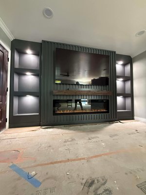 Media Walls & Accent Walls - Our Media Walls & Accent Walls are designed to transform plain spaces into architectural focal points. Each project is custom-built, blending clean geometry, modern textures, and precise detailing to elevate living rooms, hallways, bedrooms, and entertainment areas.
From bold geometric paneling and sleek slat designs to integrated shelving, lighting, and fireplace surrounds, every wall is carefully planned and executed for balance, depth, and durability. We focus on sharp lines, smooth finishes, and materials that feel solid—not just decorative.
Whether the goal is a dramatic statement wall or a refined, minimalist backdrop, these builds are tailored to the space, lighting, and overall design of the home. The result is a high-end look that feels intentional, modern, and built to last. Media Walls & Accent Walls - Our Media Walls & Accent Walls are designed to transform plain spaces into architectural focal points. Each project is custom-built, blending clean geometry, modern textures, and precise detailing to elevate living rooms, hallways, bedrooms, and entertainment areas.
From bold geometric paneling and sleek slat designs to integrated shelving, lighting, and fireplace surrounds, every wall is carefully planned and executed for balance, depth, and durability. We focus on sharp lines, smooth finishes, and materials that feel solid—not just decorative.
Whether the goal is a dramatic statement wall or a refined, minimalist backdrop, these builds are tailored to the space, lighting, and overall design of the home. The result is a high-end look that feels intentional, modern, and built to last.