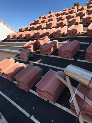 Raise and reset with flat roof installation - Raise all tile above low slope garage only and flat roof installation