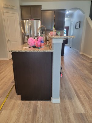 Kitchen Remodel 2021 - We had the opportunity to work with a loyal customer that we previously installed flooring for. Previously we converted and upgraded their light brown tile kitchen floors and dark brown engineered flooring into beautiful and seamless waterproof flooring that can easily withstand heavy traffic of large dogs, small children, and the everyday abuse of teenagers. Because of the quality of work on this previous project the customer had full confidence in our ability to give them an even more stunning kitchen remodel. We removed all of the countertops (to include a 2nd tier island bar, extended the island to include a beverage cooler, installed stone around the island, and completed the look off with custom quartzite countertops (sub contracted), countertop garbage disposal air switch, customer selected a gorgeous backsplash that we installed, and added undercabinet dimmable led lighting for an added wow. Kitchen Remodel 2021 - We had the opportunity to work with a loyal customer that we previously installed flooring for. Previously we converted and upgraded their light brown tile kitchen floors and dark brown engineered flooring into beautiful and seamless waterproof flooring that can easily withstand heavy traffic of large dogs, small children, and the everyday abuse of teenagers. Because of the quality of work on this previous project the customer had full confidence in our ability to give them an even more stunning kitchen remodel. We removed all of the countertops (to include a 2nd tier island bar, extended the island to include a beverage cooler, installed stone around the island, and completed the look off with custom quartzite countertops (sub contracted), countertop garbage disposal air switch, customer selected a gorgeous backsplash that we installed, and added undercabinet dimmable led lighting for an added wow.
