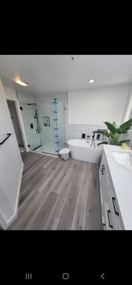 Primary Bathroom Renovation - For this bathroom we replaced the drop in tub with a free standing. Installed new waterproof laminate flooring and remodeled the walkin shower. Primary Bathroom Renovation - For this bathroom we replaced the drop in tub with a free standing. Installed new waterproof laminate flooring and remodeled the walkin shower.