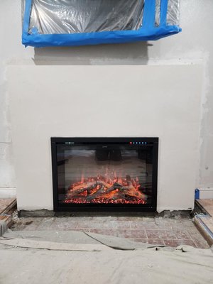 Electric Fireplace Installation - This was a brick wood burning fireplace converted into a modern electric fireplace. Here you see a Modern Flames Electric Fireplace Installation.
Call us to schedule your consultation today Electric Fireplace Installation - This was a brick wood burning fireplace converted into a modern electric fireplace. Here you see a Modern Flames Electric Fireplace Installation.
Call us to schedule your consultation today